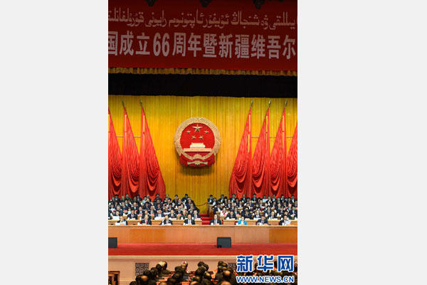 10月1日，慶祝中華人民共和國成立66周年暨新疆維吾爾自治區(qū)成立60周年大會在新疆人民會堂隆重舉行。 新華社記者 高潔 攝 