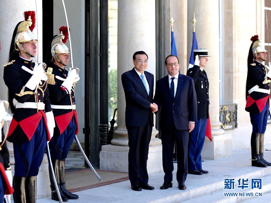 當地時間6月30日下午，中國國務院總理李克強在巴黎愛麗舍宮會見法國總統(tǒng)奧朗德。 新華社記者馬占成攝 